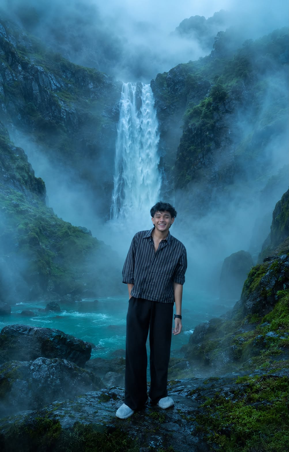 Cinematic Portrait in a Mystical Waterfall Landscape with Foggy Mountain Atmosphere